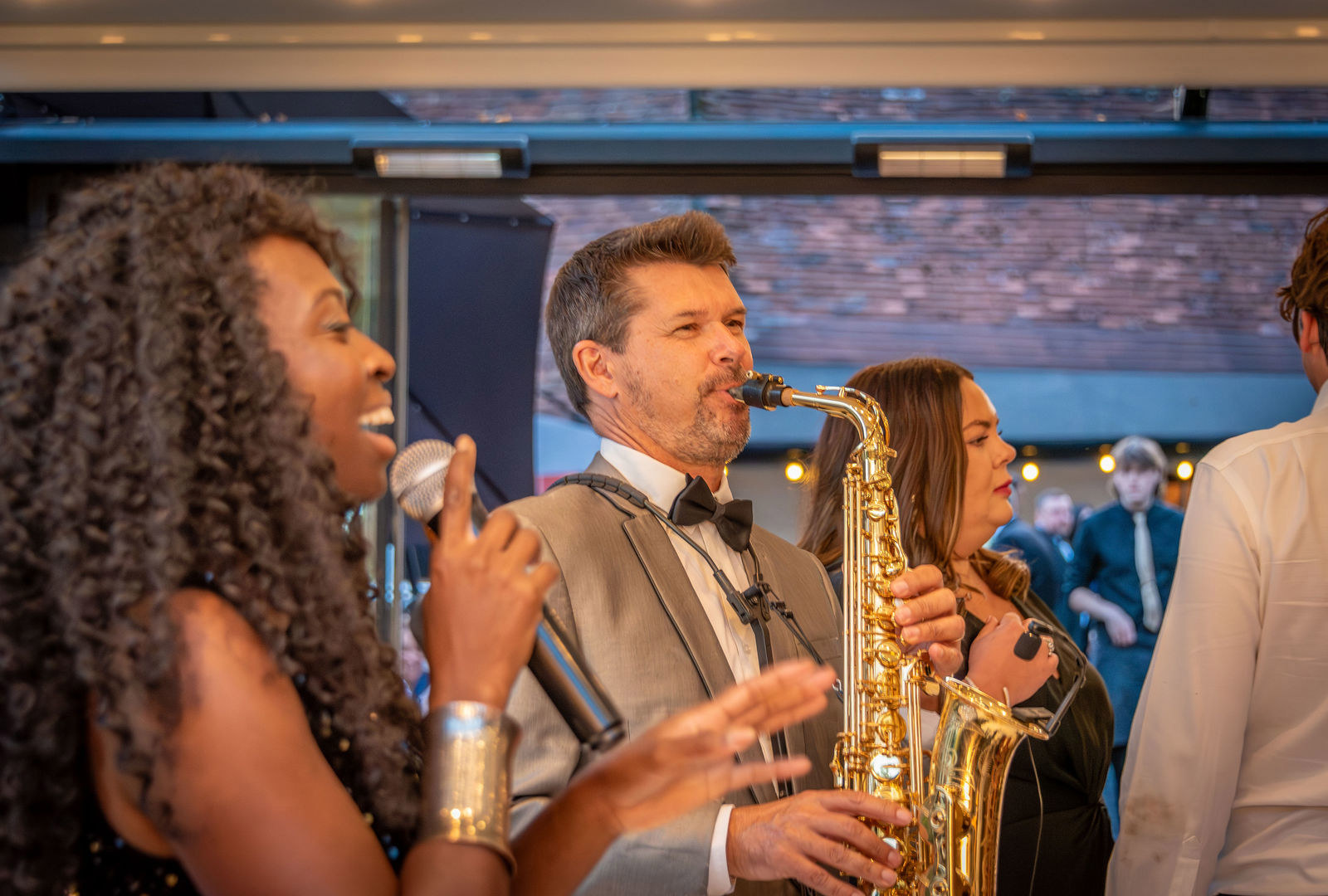 A live wedding band perform at the Buttery and Glasshouse wedding venue in Kent