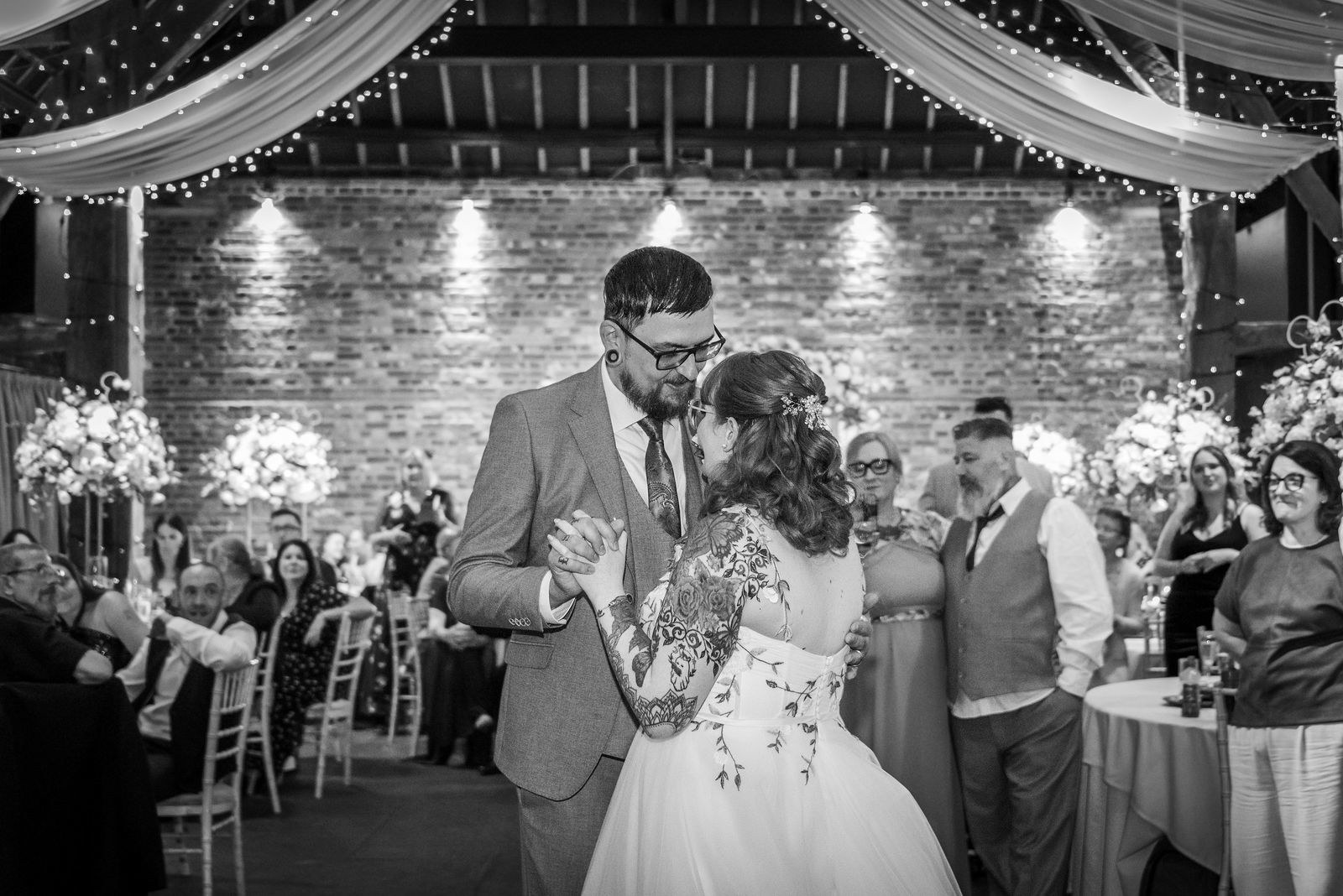 A couple enjoy their first dance at Cooling Castle Barn wedding venue