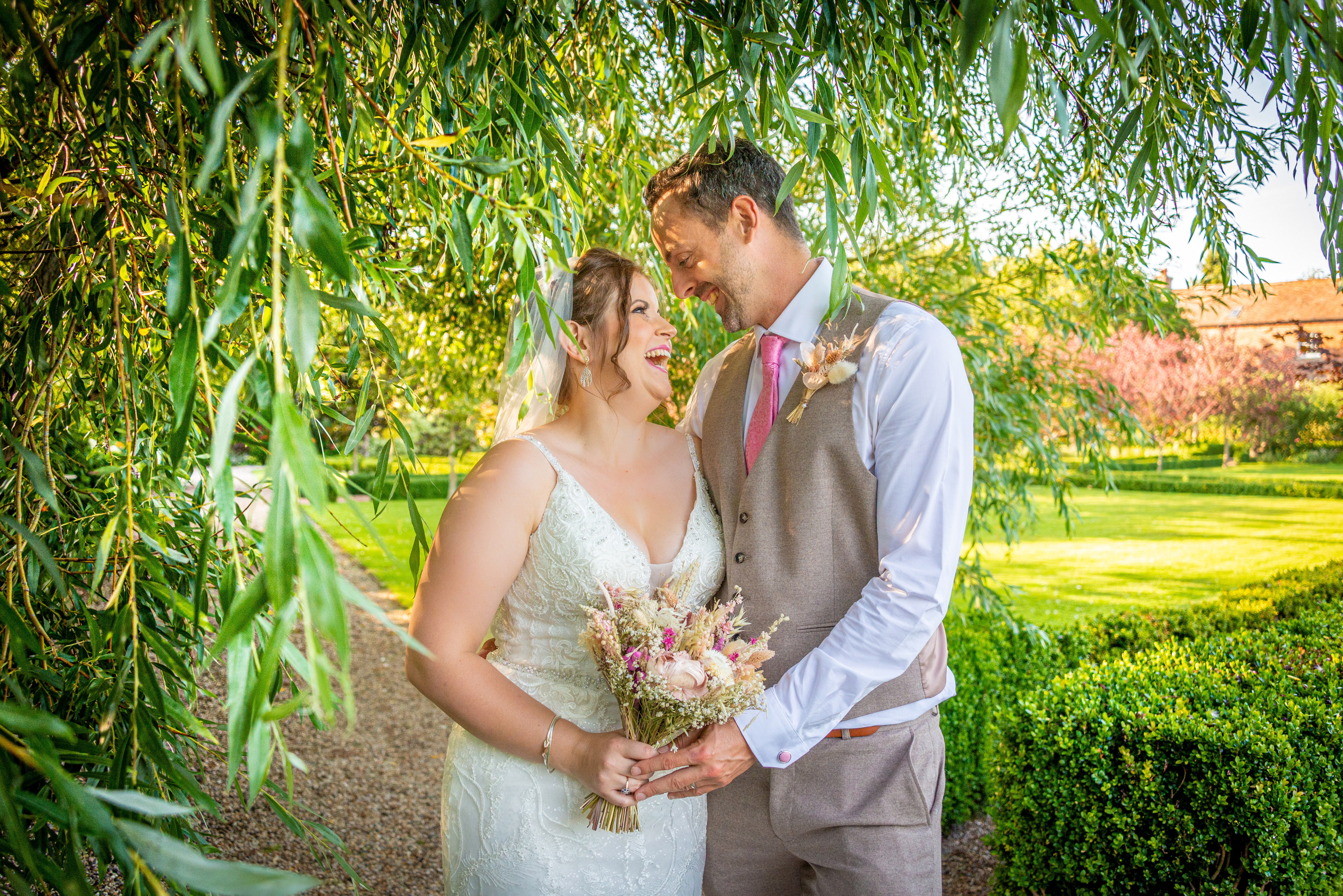 A relaxed and natural couples photo at the Secret Garden wedding venue in Kent